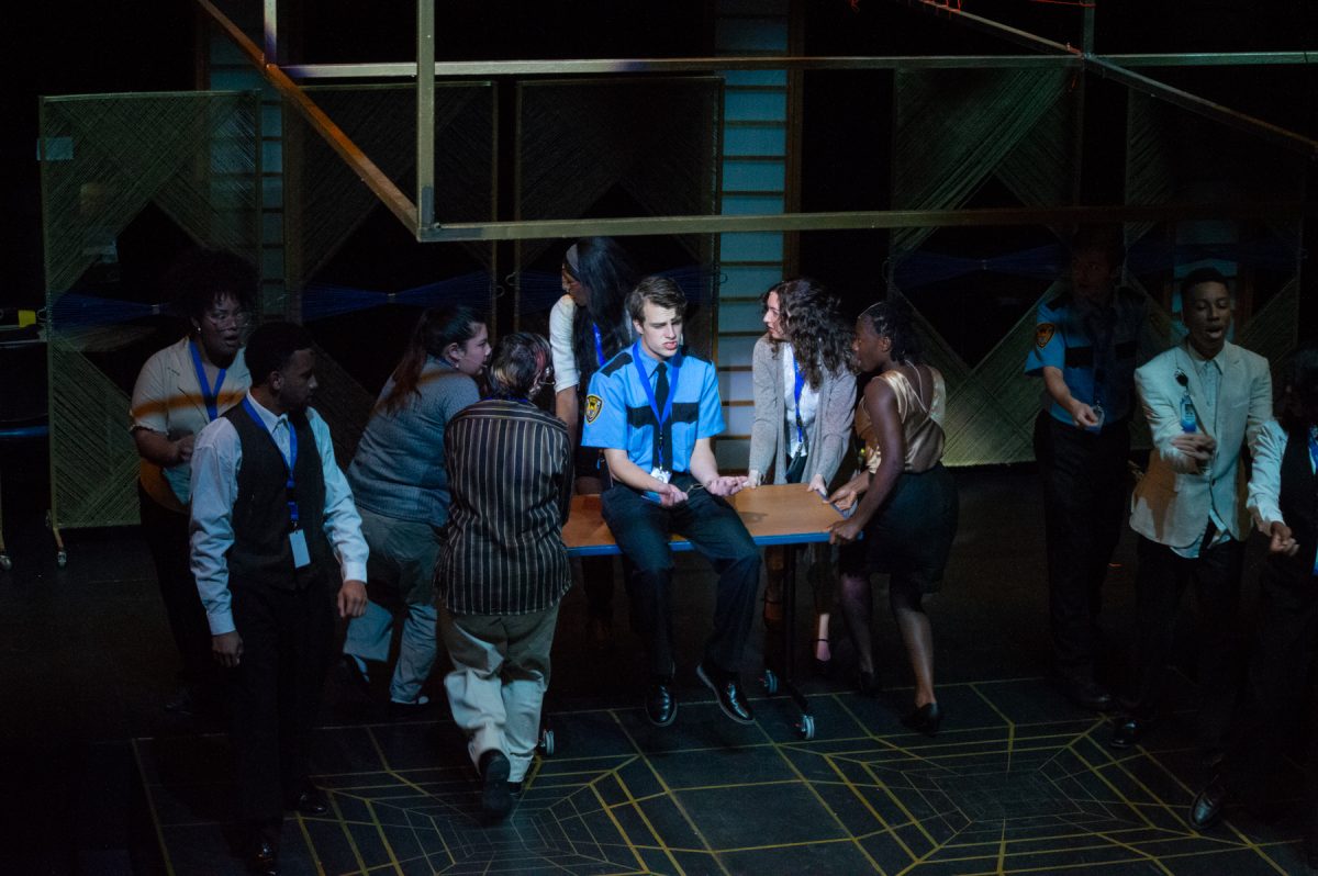 The cast of "String" performing in a set inspired by office buildings and elevators.